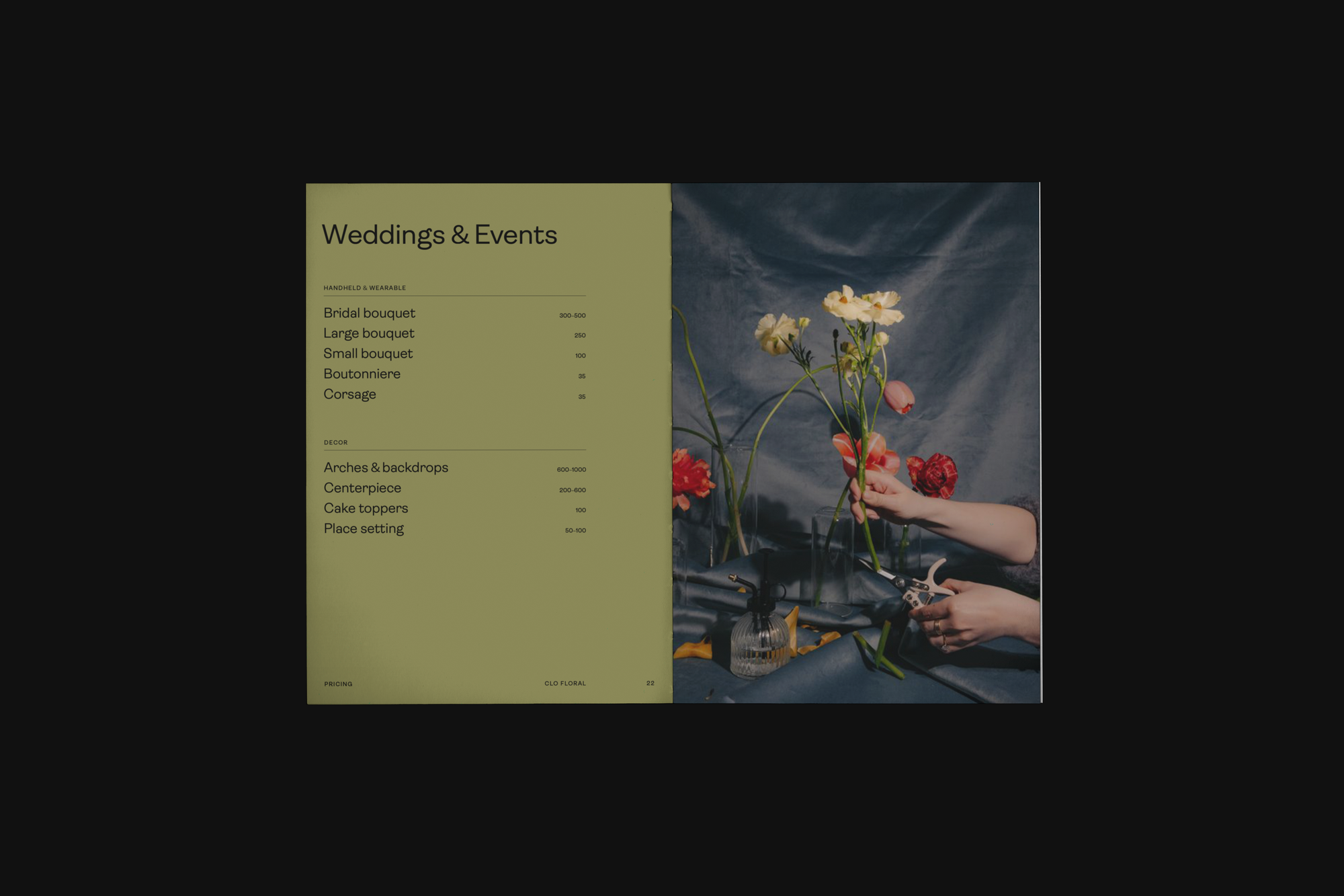 An open brochure spread with wedding florals pricing information on the left page and a photograph of a hand holding flowers on the right page