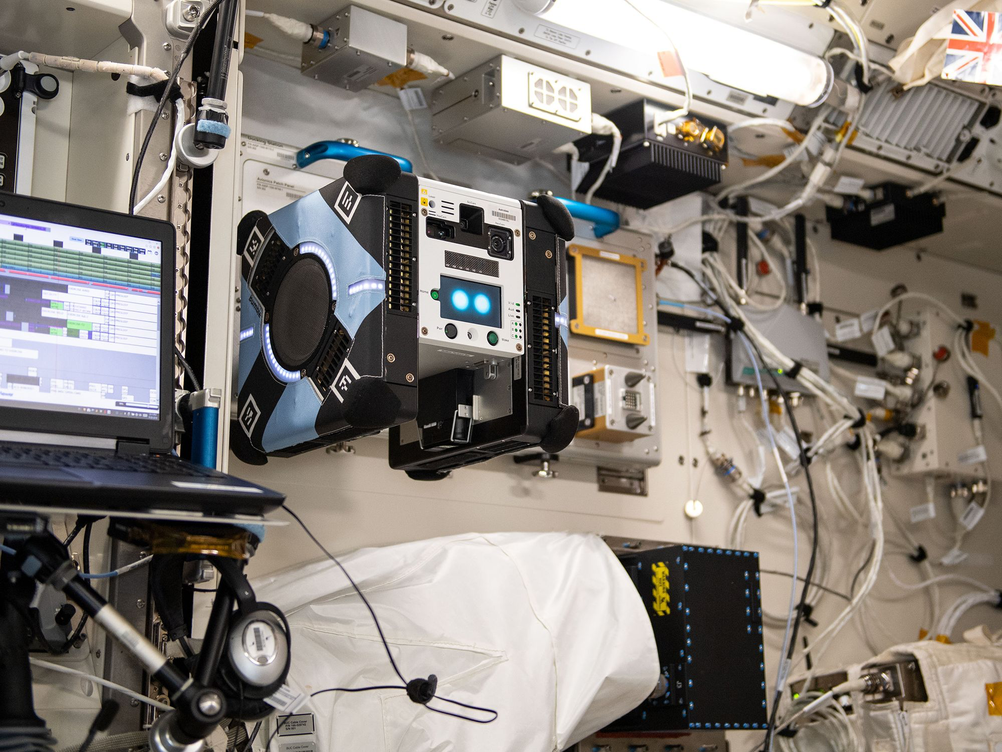 Cube-like robot called Astrobee is shown floating on the International Space Station 