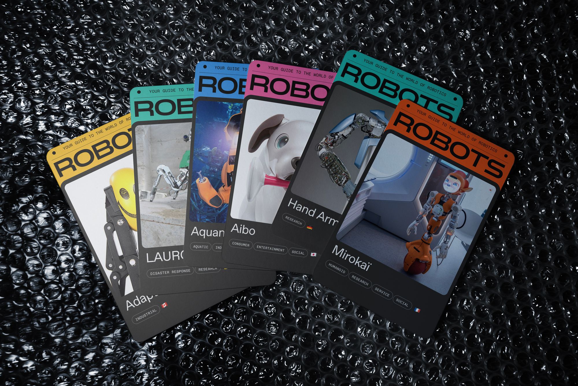 Fan of cards showing various robots with their respective names and portraits, with the ROBOTS logo across the top of each card