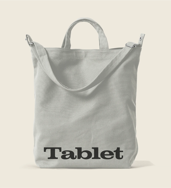 A white tote bag with a black Tablet logo running across the bottom