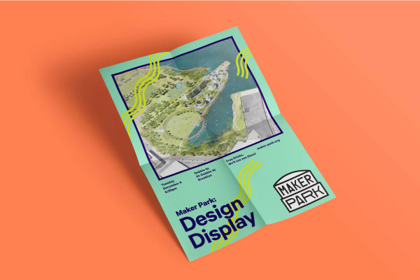 A turquoise poster with an image of park and the headline "Maker Park: Design Display" sits on an orange surface.